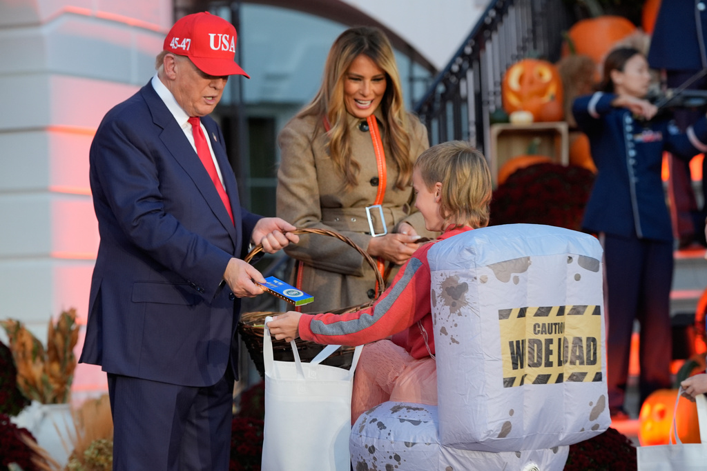 President Donald Trump and first lady Melania Trump participate in a Halloween at the White House event on the South Lawn, Thursday, Oct. 30, 2025, in Washington. (AP Photo/Alex Brandon)