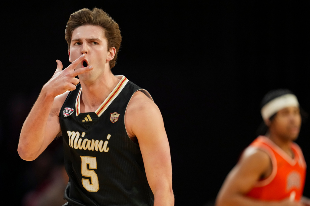 Miami (Ohio) guard Peter Suder reacts after scoring during the first half of an NCAA college basketball game against Bowling Green, Friday, Feb. 20, 2026, in Oxford, Ohio. (AP Photo/Jeff Dean)