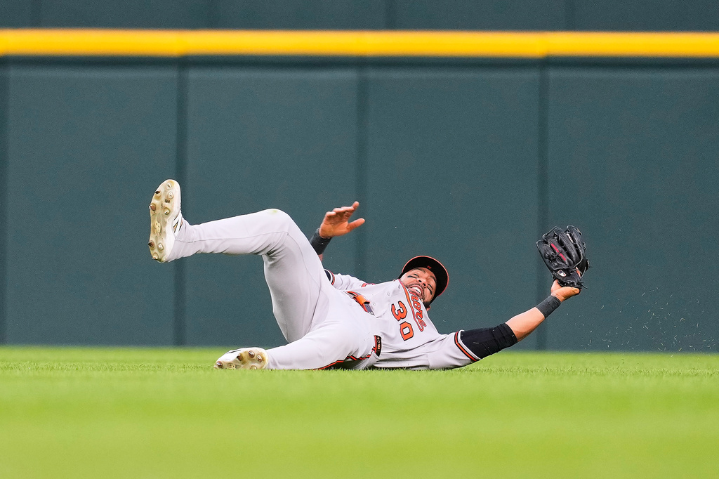 Baltimore Orioles center fielder Leody Taveras catches a Detroit Tigers' Zach McKinstry fly ball during the sixth inning of a baseball game Tuesday, July 28, 2026, in Detroit. (AP Photo/Paul Sancya)