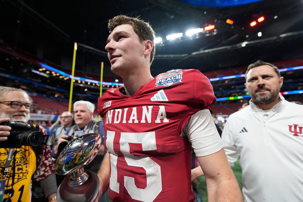 Indiana quarterback Fernando Mendoza (15) celebrates after the Peach Bowl NCAA college football playoff semifinal against Oregon, Friday, Jan. 9, 2026, in Atlanta. (AP Photo/Brynn Anderson)