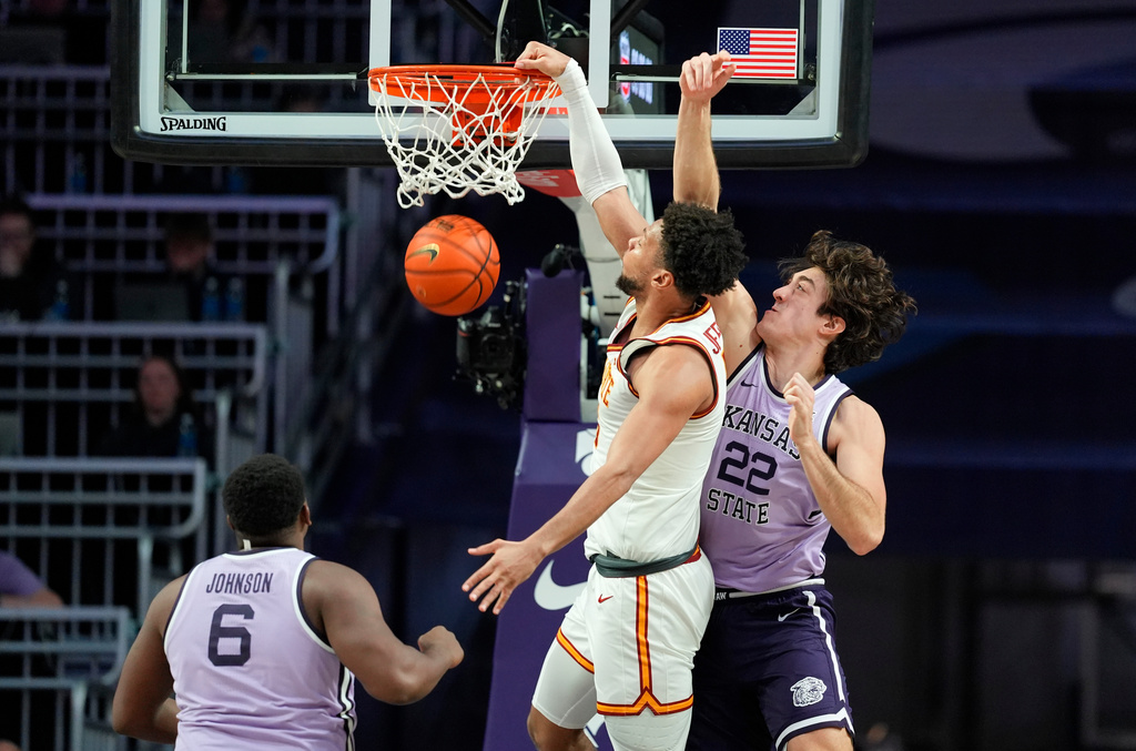 Iowa State forward Joshua Jefferson, second from right, dunks against Kansas State center Dorin Buca (22) during the second half of an NCAA college basketball game, Sunday, Feb. 1, 2026, in Manhattan, Kan. (AP Photo/Nick Krug)