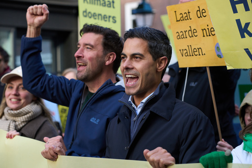 Rob Jetten,leader of the Democrats 66, D66, right, joined thousands of people who demonstrated calling for tougher action against climate change just days before the Oct. 29 general election in the Netherlands, in The Hague, Netherlands, Sunday, Oct. 26, 2025. (AP Photo/Peter Dejong) Rob Jetten,leader of the Democrats 66, D66, right, joined thousands of people who demonstrated calling for tougher action against climate change just days before the Oct. 29 general election in the Netherlands, in The Hague, Netherlands, Sunday, Oct. 26, 2025. (AP Photo/Peter Dejong)