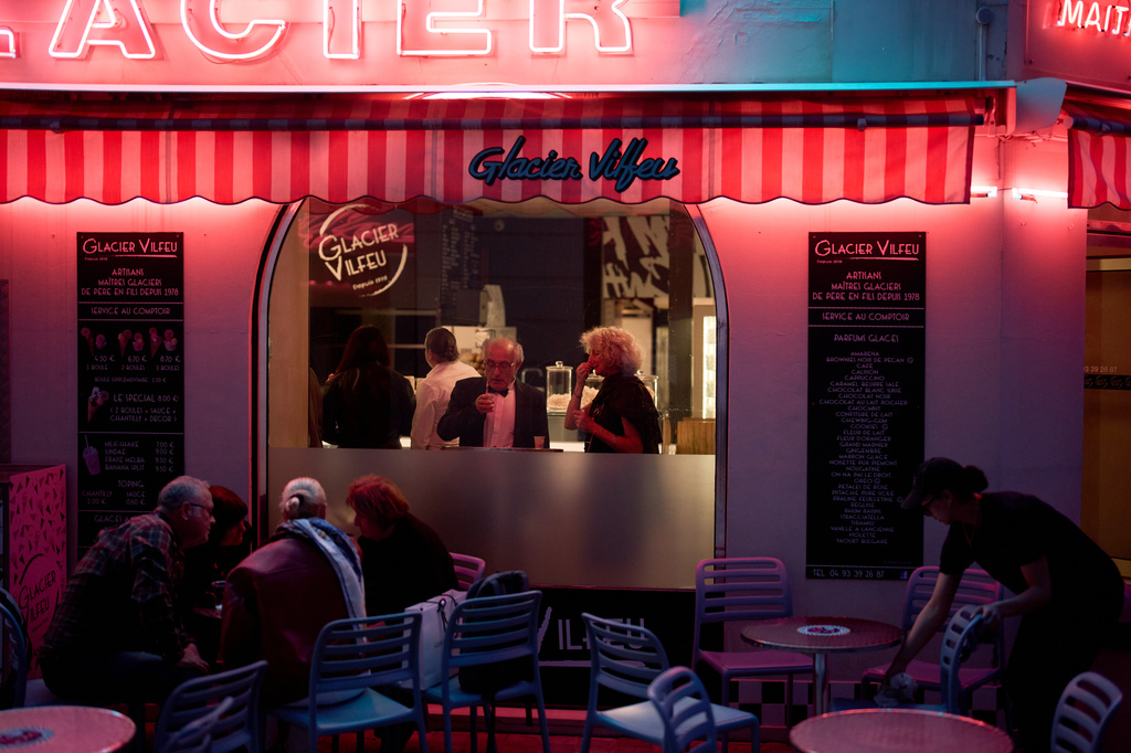 Festivalgoers eat at an ice cream shop near the 79th international film festival, Cannes, southern France, Sunday, May 17, 2026. (AP Photo/John Locher)