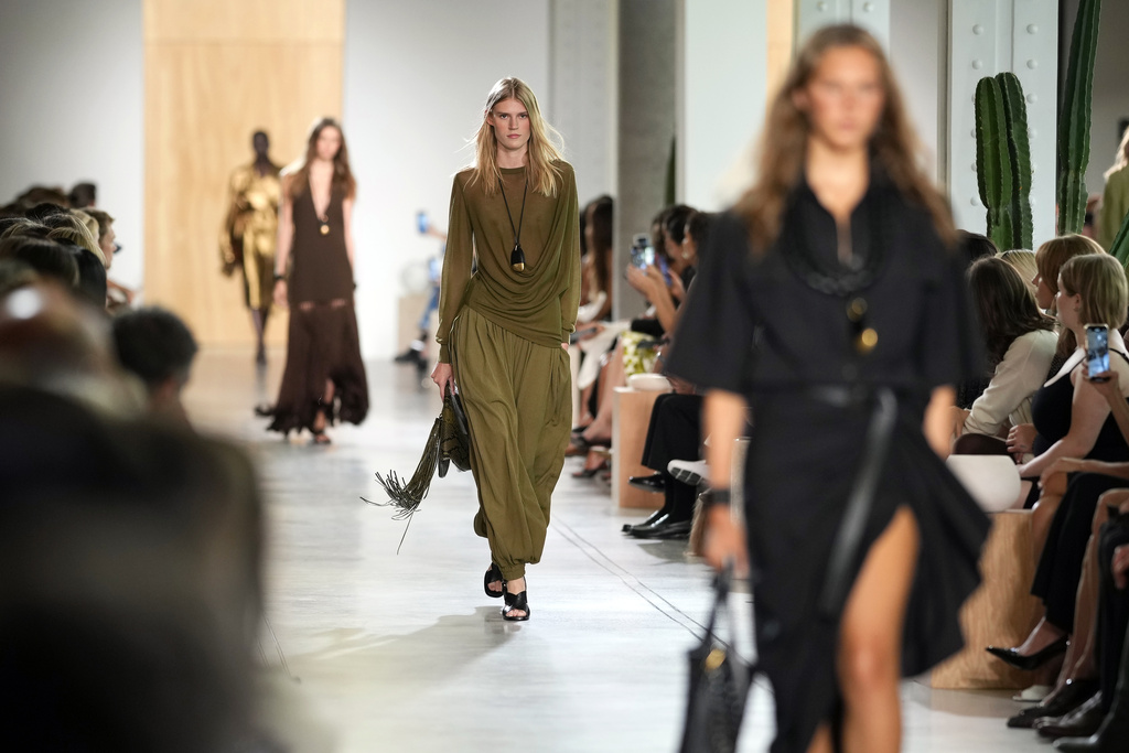 Models walk the runway during the Michael Kors Spring/Summer 2026 fashion show as part of New York Fashion Week on Thursday, Sept. 11, 2025, in New York. (Photo by Charles Sykes/Invision/AP)