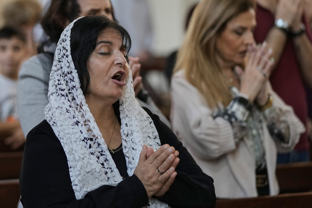 Christian worshippers take part in Sunday Mass at the Armenian Patriarchate in Antelias, north of Beirut, Lebanon, Sunday, Nov. 23, 2025. (AP Photo/Bilal Hussein)