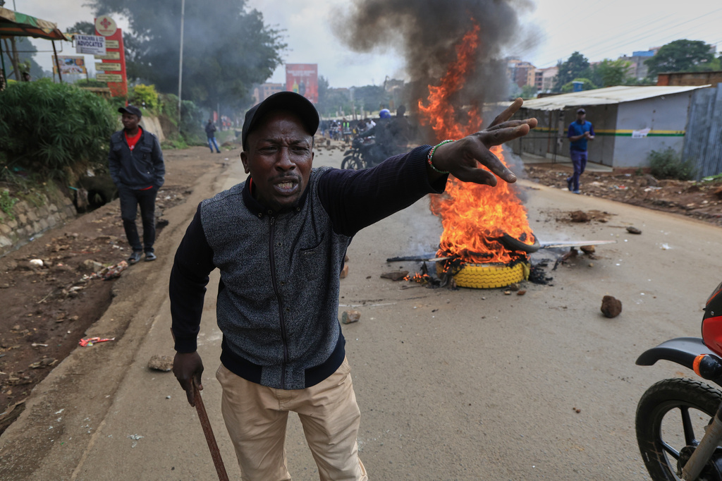 A protester gestures during a public transport strike over fuel prices in Nairobi, Kenya, Monday, May 18, 2026. (AP Photo/Andrew Kasuku)