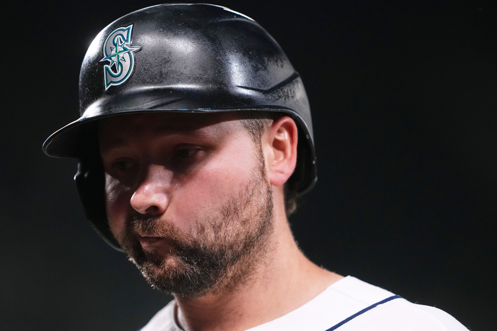 Seattle Mariners' Cal Raleigh walks back to the dugout after flying out during the ninth inning to end a baseball game in a loss to the Athletics, Monday, April 20, 2026, in Seattle. (AP Photo/Lindsey Wasson)