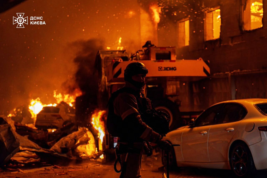 In this photo provided by the Ukrainian Emergency Service, emergency services personnel work to extinguish a fire following a Russian air attack in Kyiv, Ukraine, Wednesday, July 8, 2026. (Ukrainian Emergency Service via AP)