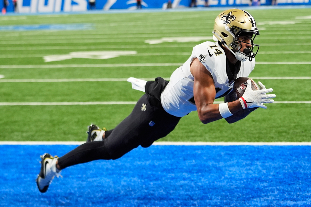 New Orleans Saints wide receiver Devaughn Vele (14) pulls in a touchdown reception against the Detroit Lions in the second half of an NFL football game, Sunday, Sept. 13, 2026, in Detroit. (AP Photo/Paul Sancya)