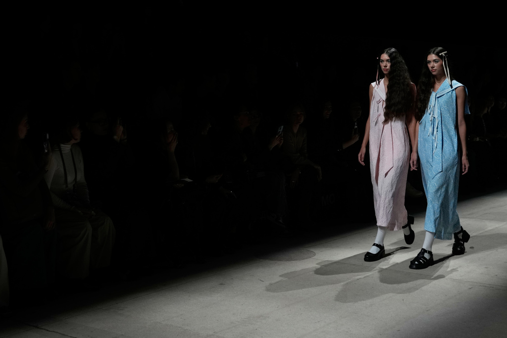 Models wear creations by Shakirova Brand on a runway during Moscow Fashion Week in Moscow, Wednesday, March 18, 2026. (AP Photo/Pavel Bednyakov)