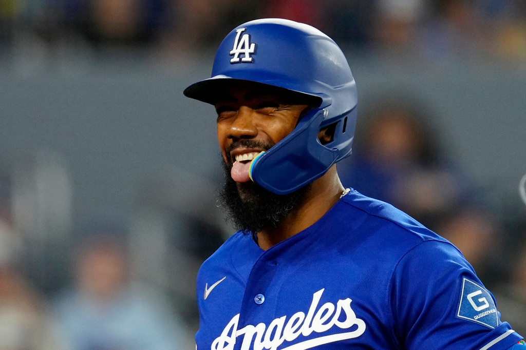 Los Angeles Dodgers' Teoscar Hernández celebrates after scoring on a two-run home run against the Toronto Blue Jays during first-inning baseball game action in Toronto, Monday, April 6, 2026. (Frank Gunn/The Canadian Press via AP)