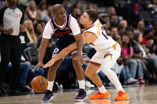 Phoenix Suns guard Collin Gillespie (12) defends Los Angeles Clippers guard Chris Paul (3) during the first half of an NBA basketball game Friday, Oct. 24, 2025, in Inglewood, Calif. (AP Photo/Kyusung Gong) Phoenix Suns guard Collin Gillespie (12) defends Los Angeles Clippers guard Chris Paul (3) during the first half of an NBA basketball game Friday, Oct. 24, 2025, in Inglewood, Calif. (AP Photo/Kyusung Gong)