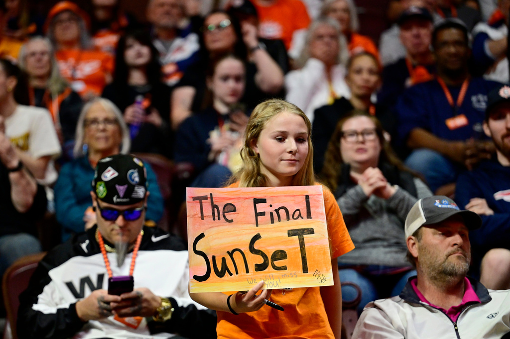 A fan holds up a sign in the first half of a WNBA basketball game between the Connecticut Sun and the Toronto Tempo, Thursday, Sept. 24, 2026, in Uncasville, Conn. (AP Photo/Jessica Hill)