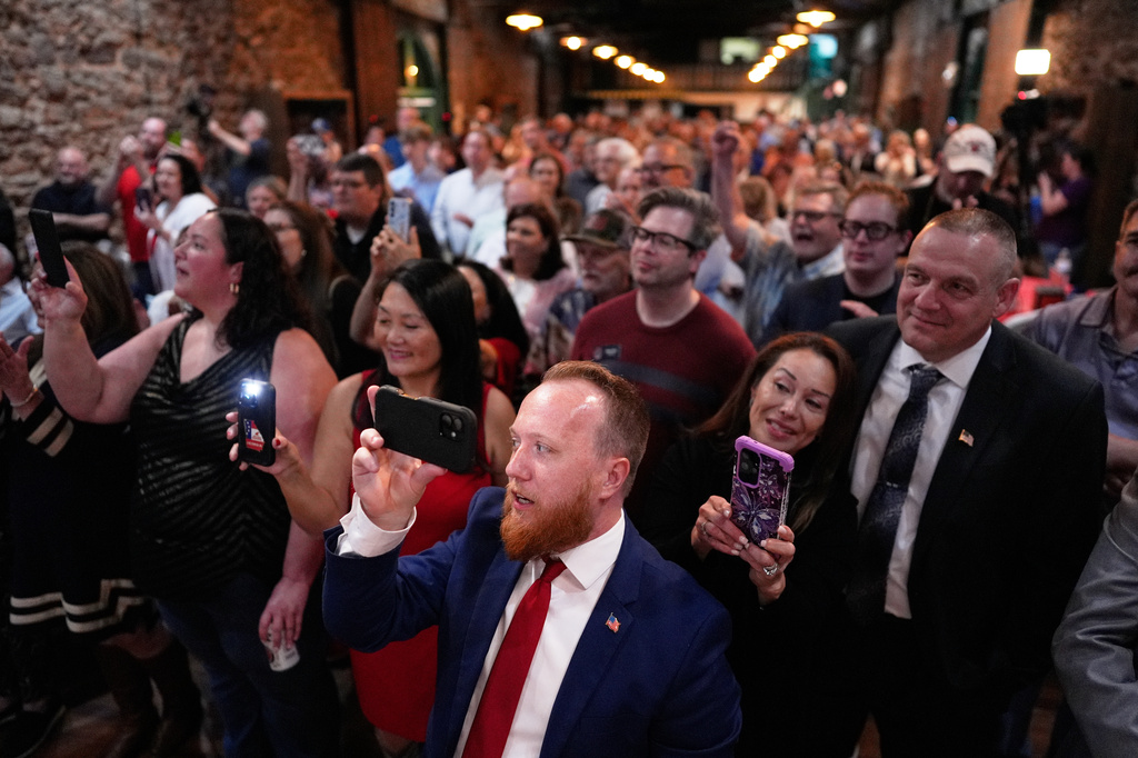 Attendees listen as Republican Clay Fuller speaks during an election night watch party after winning a special election for Georgia's 14th Congressional District, Tuesday, April 7, 2026, in Ringgold, Ga. (AP Photo/Mike Stewart)