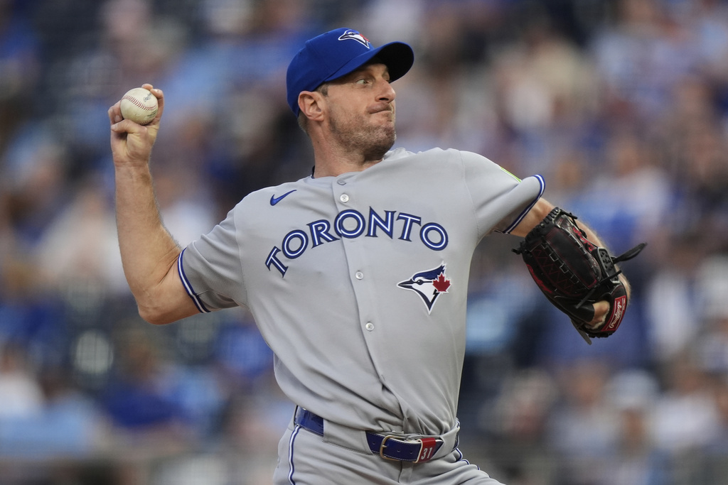 Toronto Blue Jays starting pitcher Max Scherzer throws during the first inning of a baseball game against the Kansas City Royals, Friday, Sept. 19, 2025, in Kansas City, Mo. (AP Photo/Charlie Riedel)
