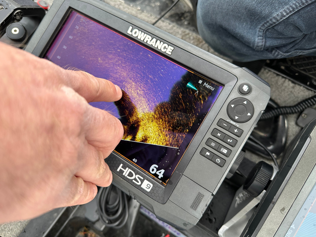 Terry Rehm points out a fish on his forward looking sonar system Saturday, May 23, 2026 in Nowthen, Minn. (AP Photo/Mark Vancleave)