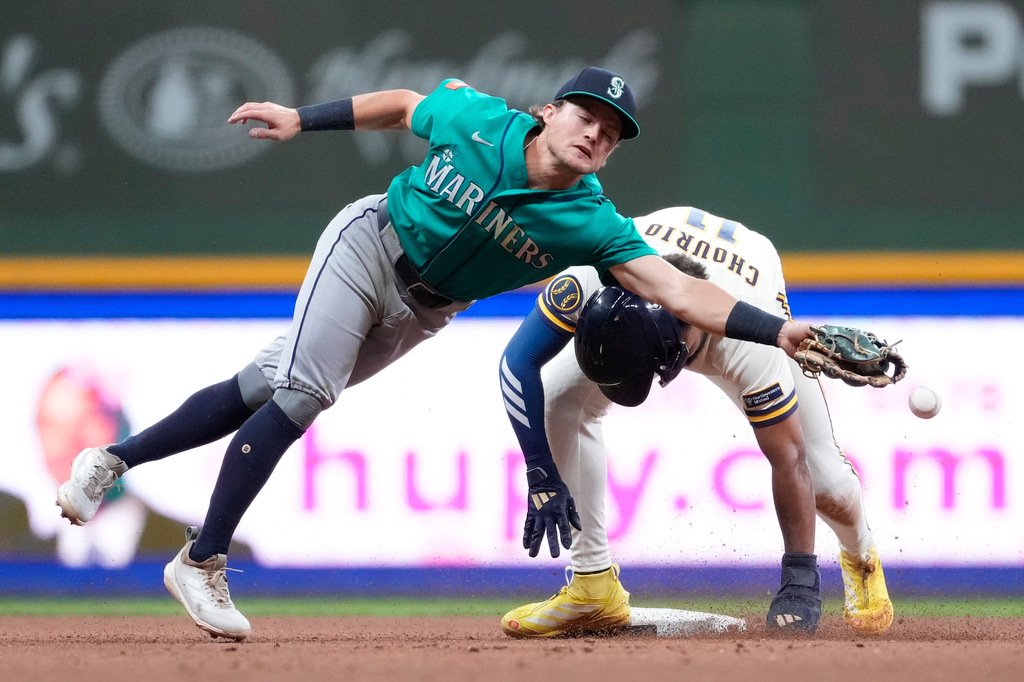 Milwaukee Brewers' Jackson Chourio steals second base as Seattle Mariners' Brock Rodden attempts to catch the ball during the fifth inning of a baseball game Wednesday, Aug. 19, 2026, in Milwaukee. (AP Photo/Aaron Gash)