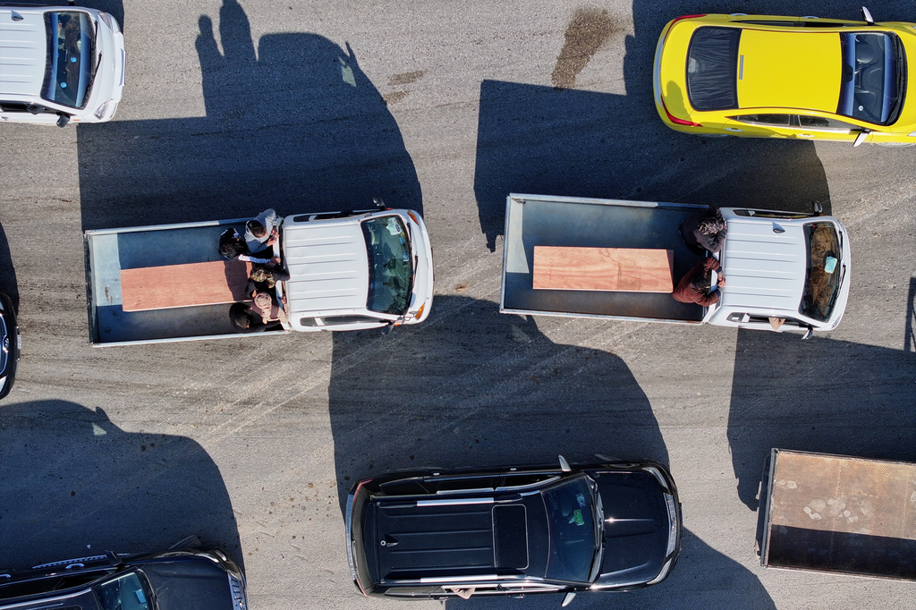 Two of the six coffins of members of the Al-Jalib family, who were killed Wednesday in Israeli strikes in Beirut, are carried for burial during their funeral in the village of al-Sour, Deir al-Zour province, northeastern Syria, Saturday, April 11, 2026. (AP Photo/Ghaith Alsayed)