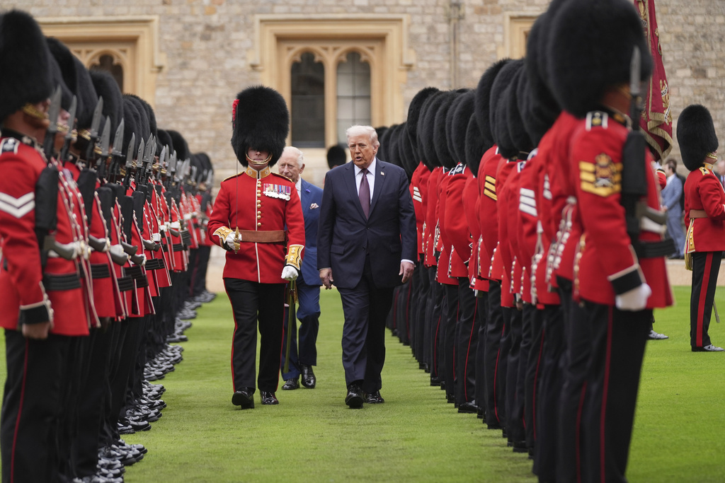 President Donald Trump and Britain's King Charles III inspect the guard of honor during an arrival ceremony at Windsor Castle, in Windsor, England, Wednesday, Sept. 17, 2025. (AP Photo/Evan Vucci)