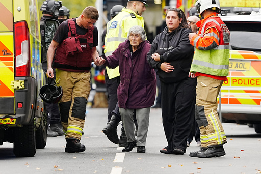 A member of the public is helped from the scene of a stabbing incident at Heaton Park Hebrew Congregation synagogue, in Crumpsall, Manchester, England, Thursday Oct. 2, 2025. (Peter Byrne/PA via AP) A member of the public is helped from the scene of a stabbing incident at Heaton Park Hebrew Congregation synagogue, in Crumpsall, Manchester, England, Thursday Oct. 2, 2025. (Peter Byrne/PA via AP)