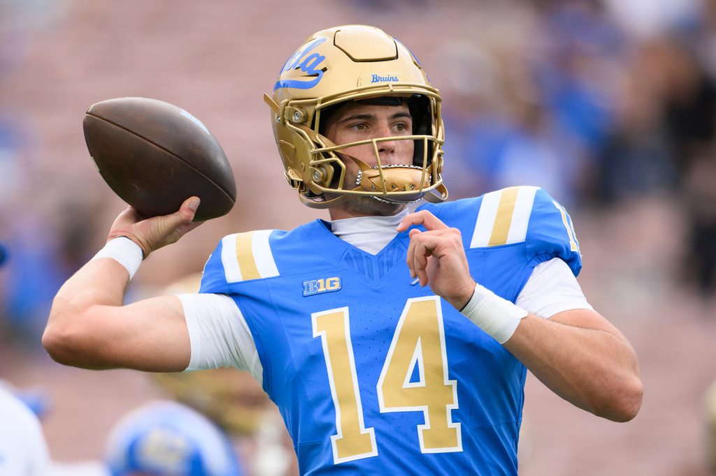 UCLA quarterback Ty Dieffenbach (14) warms up before an NCAA college football game against Wisconsin Saturday, Oct. 17, 2026, in Pasadena, Calif. (AP Photo/Kyusung Gong)