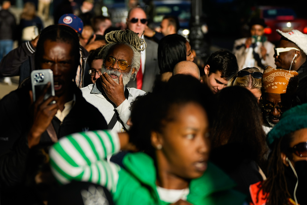 People wait outside to enter the Manhattan federal court for the sentencing of Sean "Diddy" Combs in New York, Friday, Oct. 3, 2025. (AP Photo/Eduardo Munoz Alvarez)