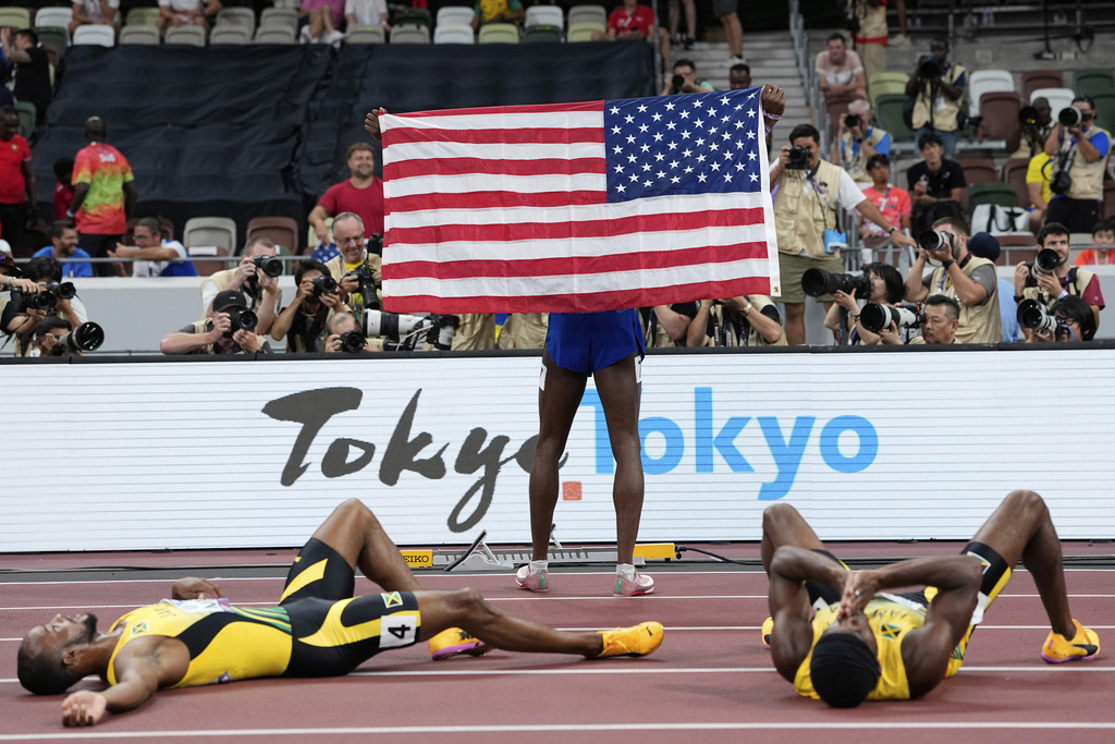 United States' Cordell Tinch poses for photos after winning the men's 110 meters hurdles final at the World Athletics Championships in Tokyo, Tuesday, Sept. 16, 2025. (AP Photo/Ashley Landis)