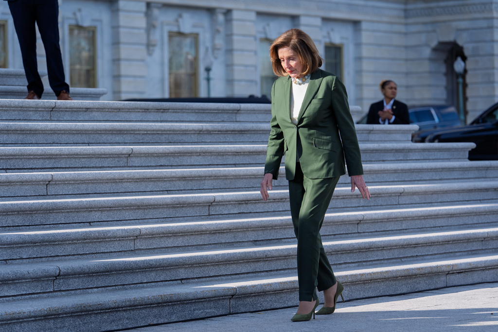 Speaker Emerita Nancy Pelosi, D-Calif., who has announced she will not seek reelection to the U.S. House, walks to join fellow Democrats at an event on the health care fight on the steps of the House before votes to end the government shutdown, at the Capitol in Washington, Wednesday, Nov. 12, 2025. (AP Photo/J. Scott Applewhite)