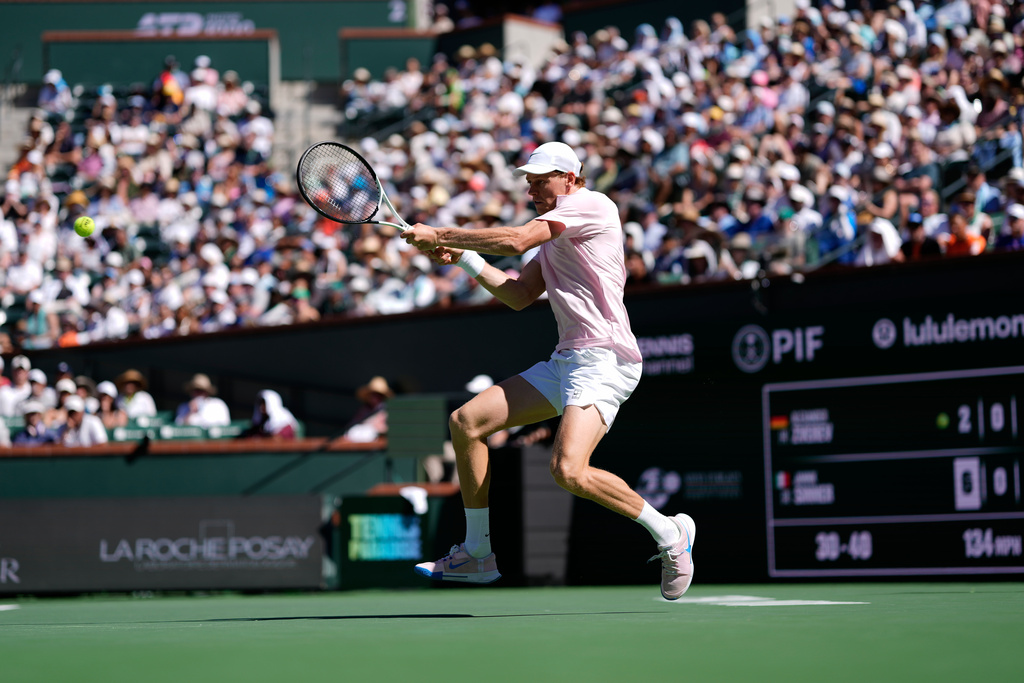 Jannik Sinner, of Italy, returns a shot against Alexander Zverev, of Germany, during a semifinal match at the BNP Paribas Open tennis tournament, Saturday, March 14, 2026, in Indian Wells, Calif. (AP Photo/Mark J. Terrill)
