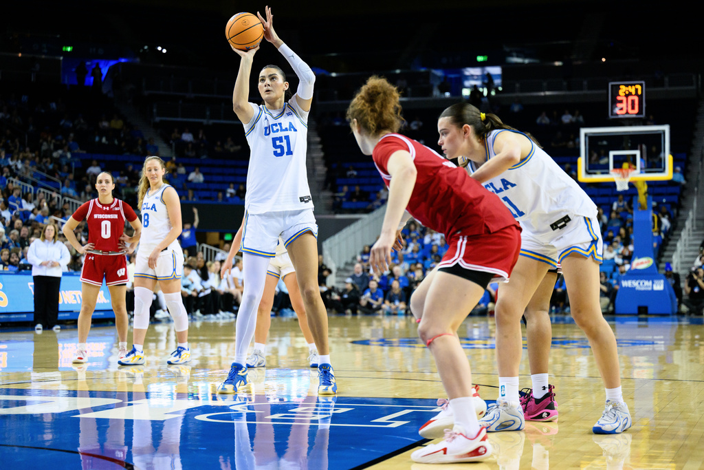 UCLA center Lauren Betts (51) shoots a free throw during the first half of an NCAA college basketball game against Wisconsin, Sunday, Feb. 22, 2026, in Los Angeles. (AP Photo/William Liang)