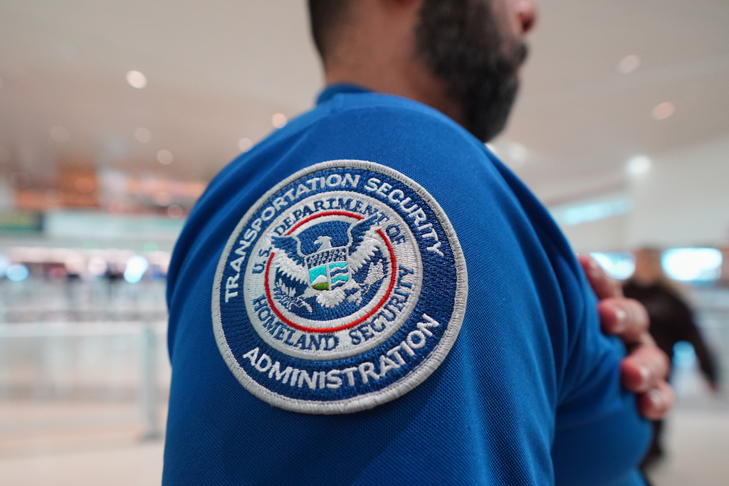 A TSA agent wears a U.S. Department of Homeland Security patch on their uniform at Love Field Airport, in Dallas, Wednesday, Feb. 18, 2026. (AP Photo/LM Otero)