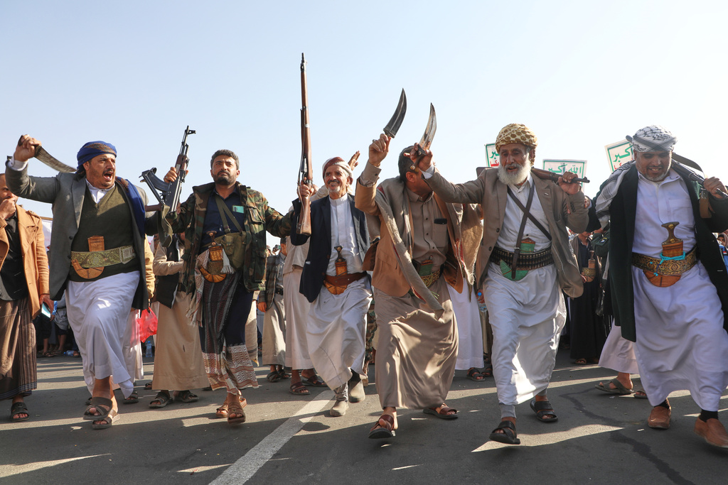 Houthi supporters dance as they celebrate following the announcement that Israel and Hamas have agreed to the first phase of a peace plan to pause the fighting, in Sanaa, Yemen, Friday, Oct. 10, 2025. (AP Photo/Osamah Abdulrahman)