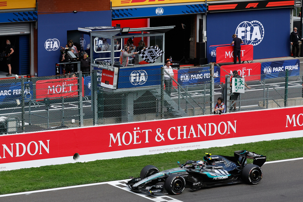 The checkered flag is waved as Mercedes driver Andrea Kimi Antonelli of Italy crosses the finish line to win the Formula One Grand Prix at the Spa-Francorchamps racetrack in Spa, Belgium, Sunday, July 19, 2026. (AP Photo/Geert Vanden Wijngaert)