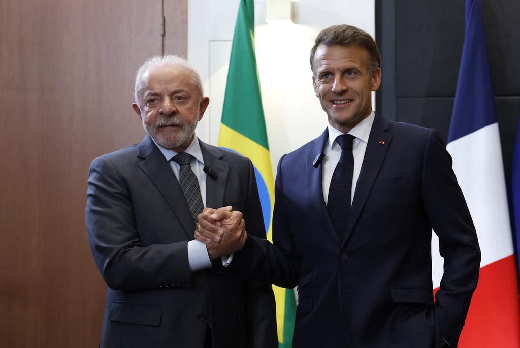 French President Emmanuel Macron and Brazilian President Luiz Inacio Lula da Silva, left, attend a bilateral meeting on the sidelines of the G7 summit in Evian-les-Bains, France, Monday, June 15, 2026. (Yoan Valat, Pool Photo via AP)