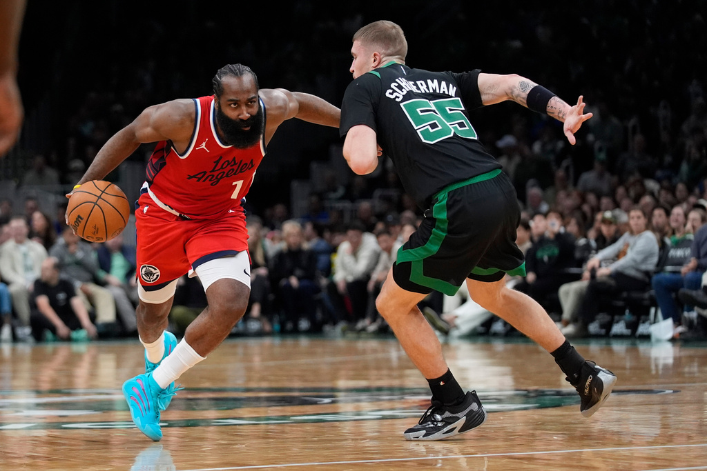 Los Angeles Clippers James Harden drives against Boston Celtics Baylor Scheierman during the first half of an NBA basketball game, Sunday, Nov. 16, 2025, in Boston. (AP Photo/Robert F. Bukaty)
