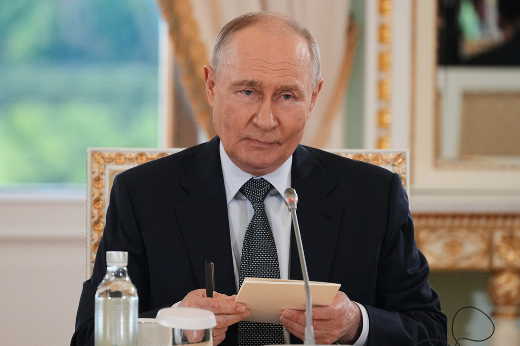 Russian President Vladimir Putin meets with representatives of international news agencies on the sidelines of the St. Petersburg International Economic Forum at the Constantine Palace in St. Petersburg, Russia, on Thursday, June 4, 2026. (AP Photo/Dmitri Lovetsky, Pool)