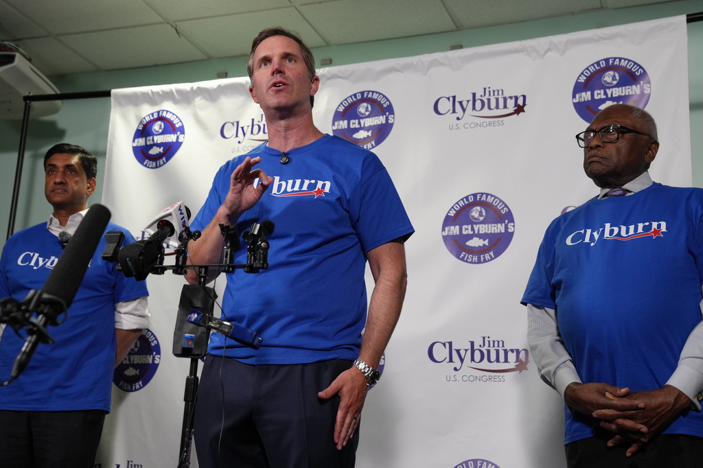Democratic Gov. Andy Beshear of Kentucky, center, speaks to reporters as U.S. Rep. Ro Khanna, D-Calif., and U.S. Rep. Jim Clyburn, D-S.C., look on, ahead of remarks at Clyburn's "World Famous Fish Fry" event on Friday, May 29, 2026, in Columbia S.C. (AP Photo/Meg Kinnard)