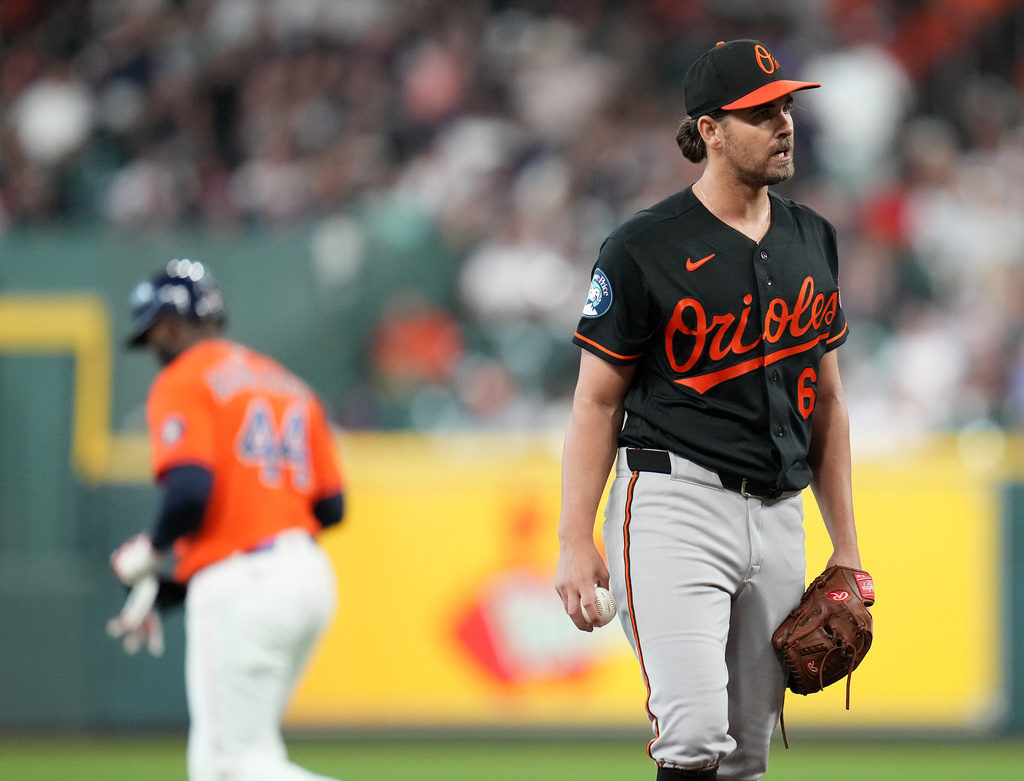 Baltimore Orioles starting pitcher Dean Kremer, foreground, reacts after Houston Astros' Yordan Alvarez hit a double during the first inning of a baseball game, Friday, July 17, 2026, in Houston. (AP Photo/Karen Warren)