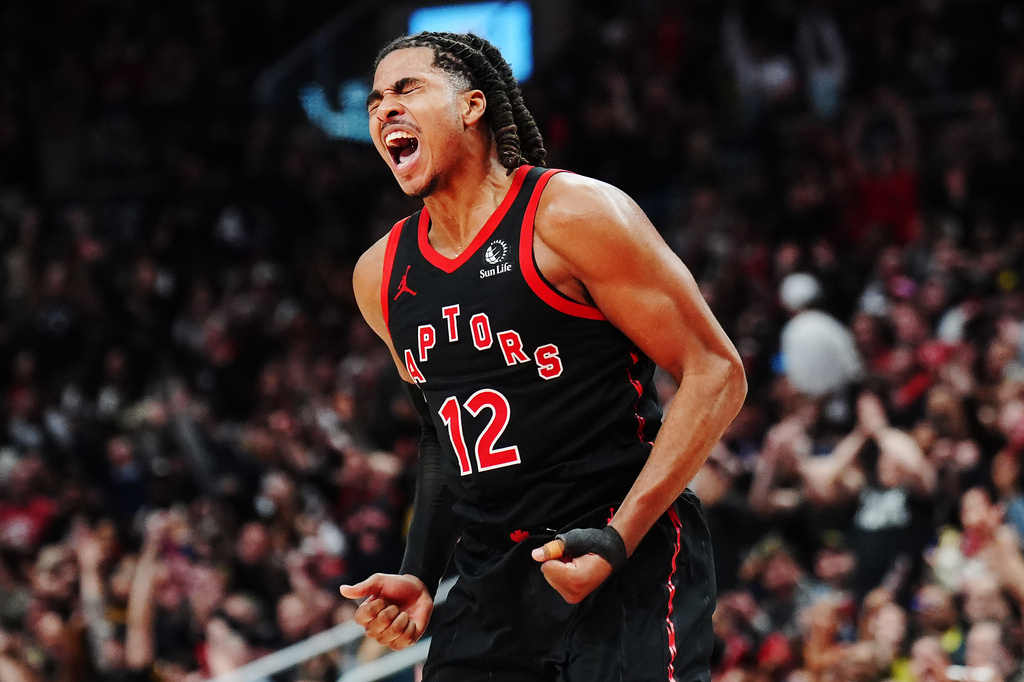 Toronto Raptors' Collin Murray-Boyles (12) celebrates a basket against the Cleveland Cavaliers during the second half of an NBA playoff basketball game in Toronto on Thursday, April 23, 2026. (Frank Gunn/The Canadian Press via AP)