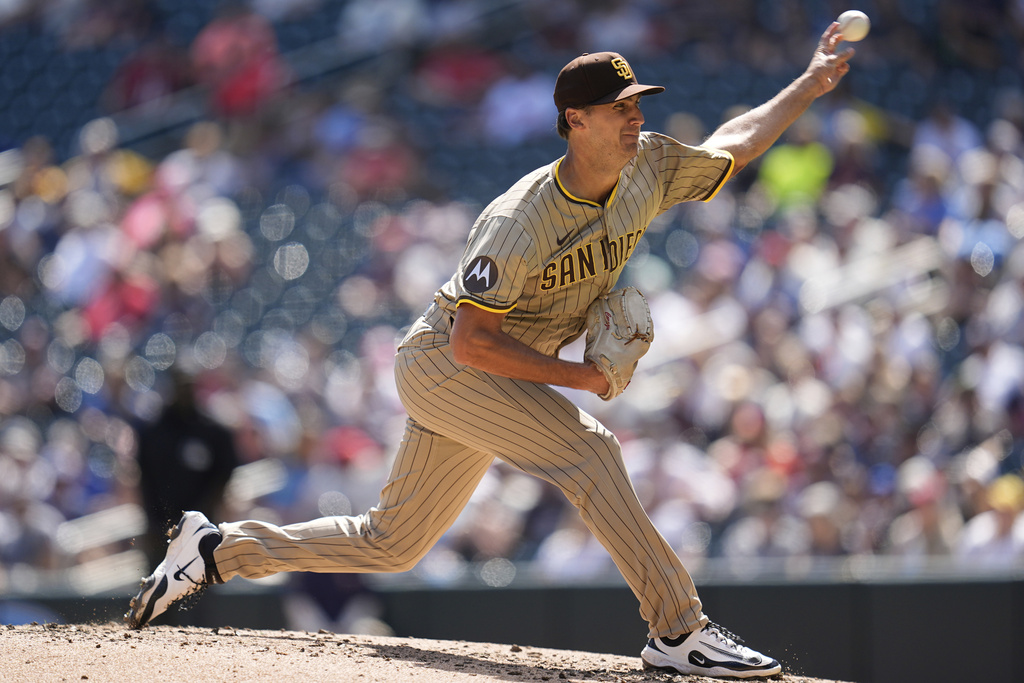 San Diego Padres relief pitcher Kyle Hart delivers during the third inning of a baseball game against the Minnesota Twins, Sunday, Aug. 31, 2025, in Minneapolis. (AP Photo/Abbie Parr)