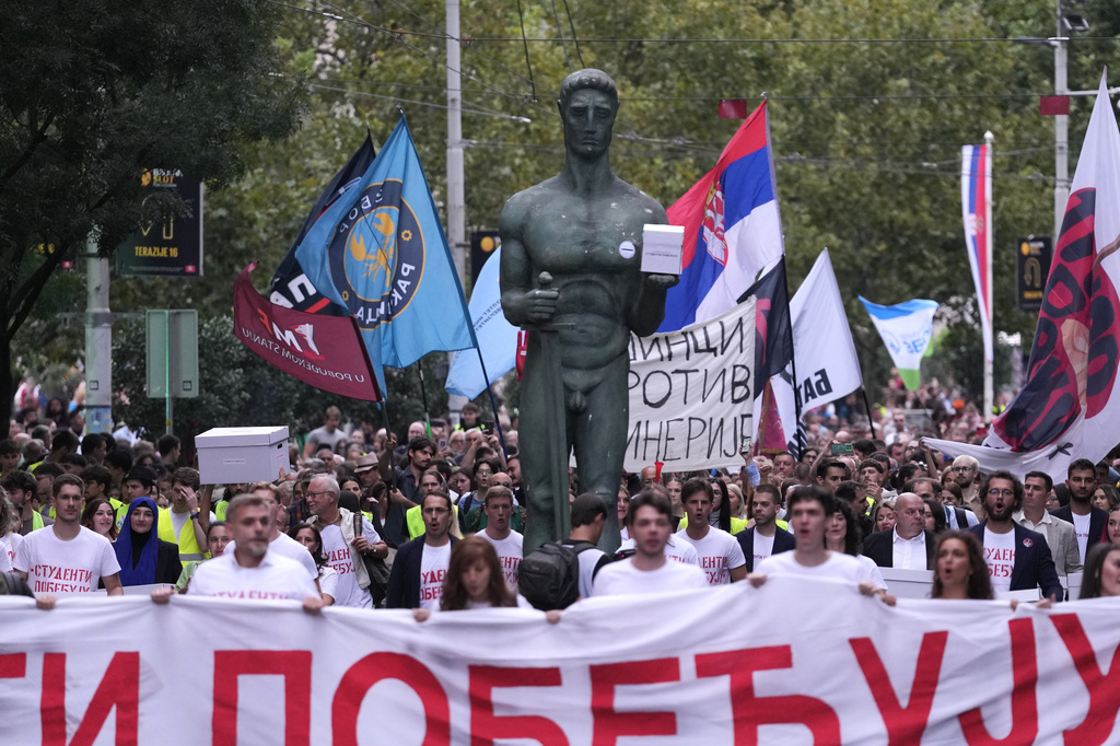 Political candidates, students and citizens carry signatures for the "Student list - Students win" to the Republic Election Commission towards participation in the upcoming parliamentary elections in Belgrade, Serbia, Monday, Sept. 14, 2026. (AP Photo/Darko Vojinovic)