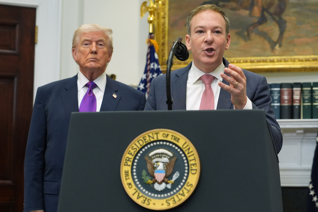 President Donald Trump listens as Environmental Protection Agency director Lee Zeldin speaks during an event announcing that the EPA will no longer regulate greenhouse gases, in the Roosevelt Room of the White House, Thursday, Feb. 12, 2026, in Washington. (AP Photo/Evan Vucci)