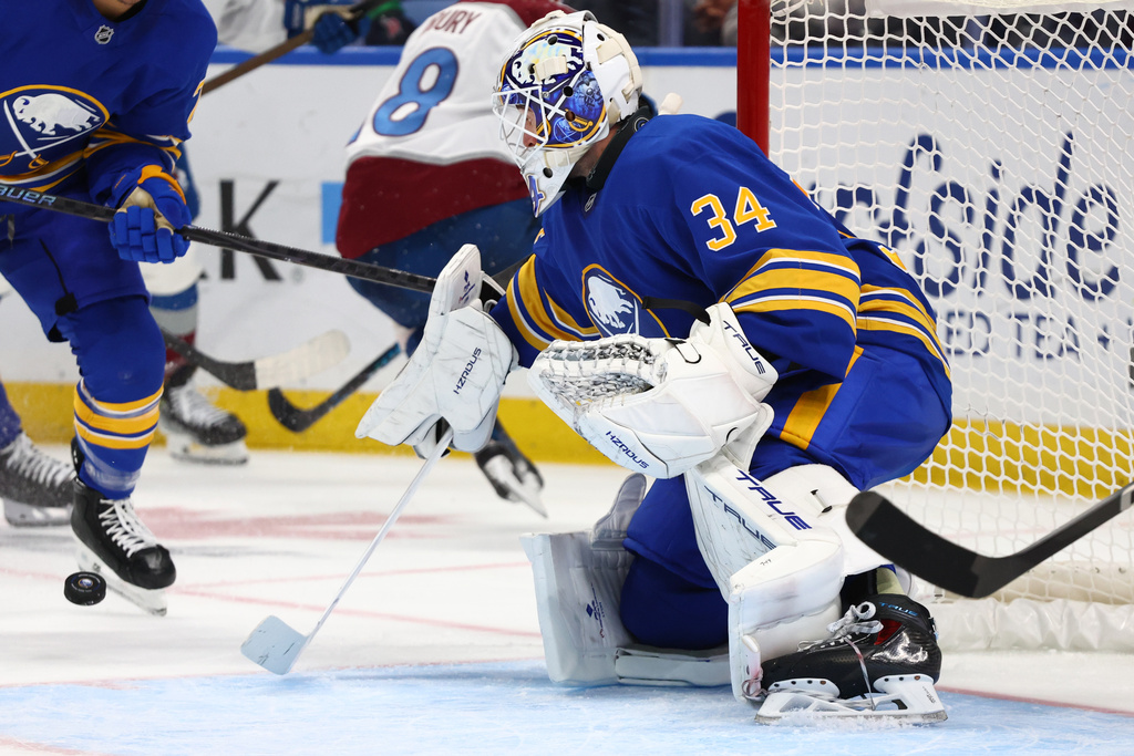 Buffalo Sabres goaltender Alex Lyon (34) watches the puck during the second period of an NHL hockey game against the Colorado Avalanche Monday, Oct. 13, 2025, in Buffalo, N.Y. (AP Photo/Jeffrey T. Barnes)