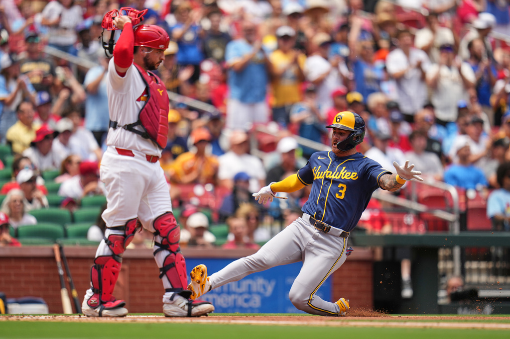 Milwaukee Brewers' Joey Ortiz (3) scores past St. Louis Cardinals catcher Jimmy Crooks during the third inning in the first game of a baseball doubleheader Tuesday, July 7, 2026, in St. Louis. (AP Photo/Jeff Roberson)