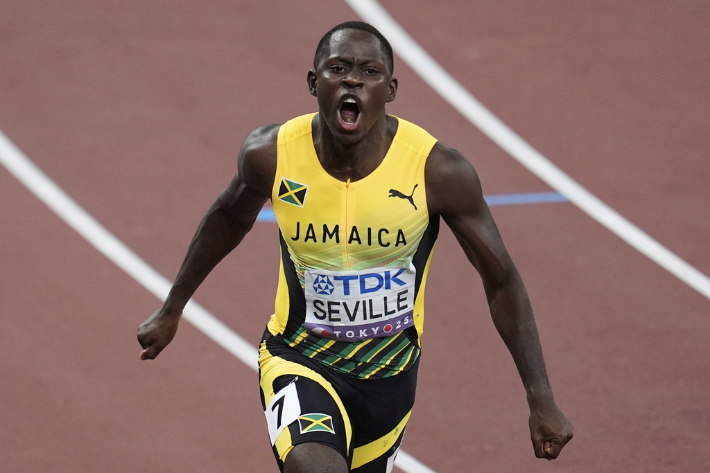 Jamaica's Oblique Seville reacts after winning the men's 100 meters final at the World Athletics Championships in Tokyo, Sunday, Sept. 14, 2025. (AP Photo/Abbie Parr)