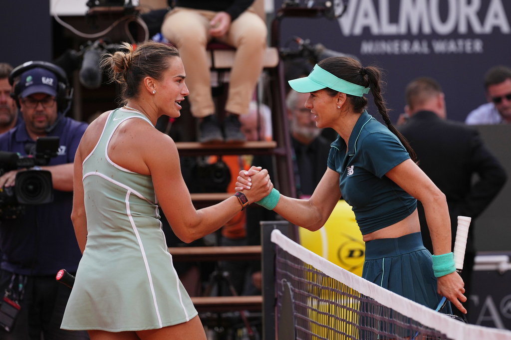 Romania's Sorana Cirstea, right, and Belarus' Aryna Sabalenka react at the end of the match at the Italian Open tennis tournament in Rome, Saturday, May 9, 2026. (AP Photo/Alessandra Tarantino)