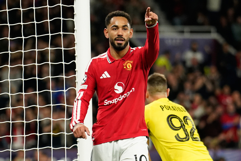 Manchester United's Matheus Cunha celebrates after he scored the opening goal during the Champions League opening phase soccer match between Manchester United and Sabah FK in Manchester, England, Thursday, Sept. 10, 2026. (AP Photo/Dave Thompson)