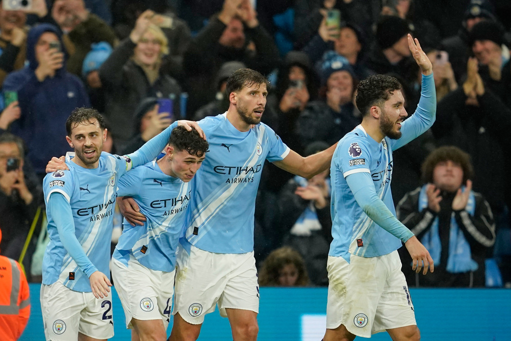 Manchester City's Phil Foden, second left, celebrates with teammates after scoring his side's third goal during the English Premier League soccer match between Manchester City and Sunderland in Manchester, England, Saturday, Dec. 6, 2025. (AP Photo/Dave Thompson)