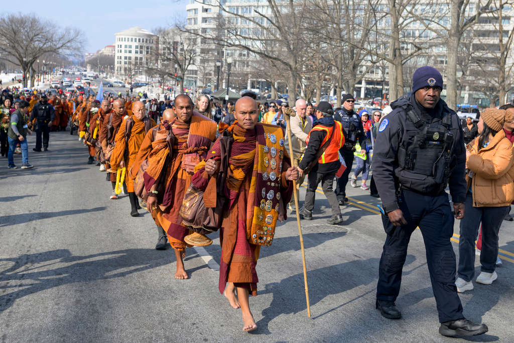 Bhikkhu Pannakara, center, leads his fellow Buddhist monks on Capitol Hill, during the Walk for Peace, in Washington, Wednesday, Feb., 11, 2026. (AP Photo/Rod Lamkey, Jr.)