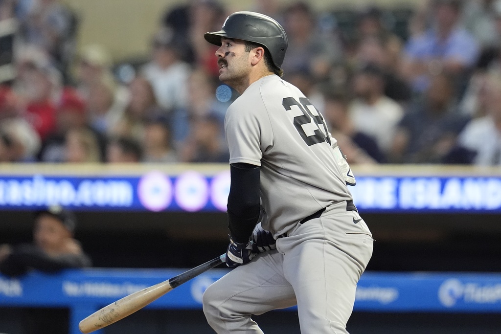 New York Yankees' Ben Rice (22) hits a single against the Minnesota Twins in the third inning of a baseball game, Tuesday, Sept. 16, 2025, in Minneapolis. (AP Photo/Mike Stewart)